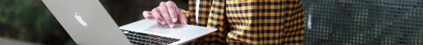 A Seattle University student holds a laptop